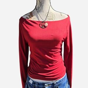 Off the shoulder rouched fitted top in red.